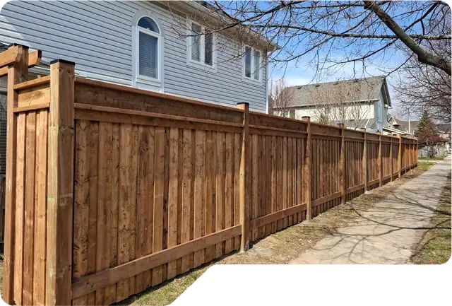 Wood privacy fence installed beside a Niagara home
