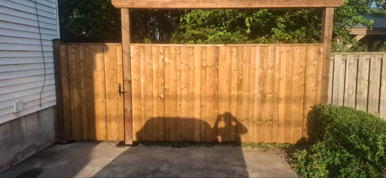 Wood privacy fence and gate replacement in Niagara Falls showing finished wood fence and gate wide view